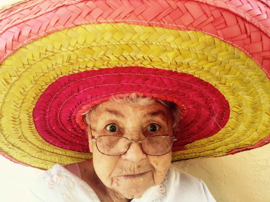Old woman with glasses and large hat