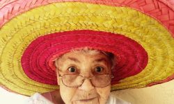 Old woman with glasses and large hat