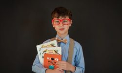 schoolboy with books and wearing glasses